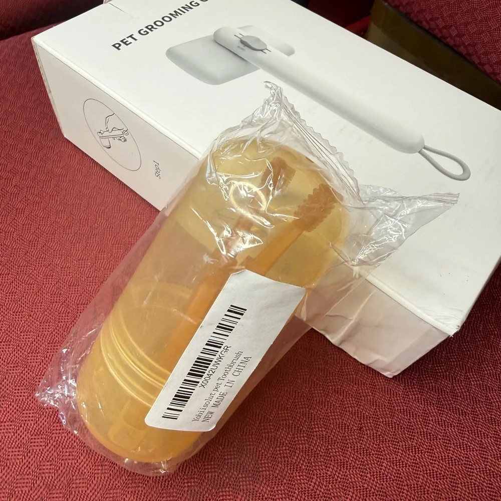 Orange and Gray Grooming Brush